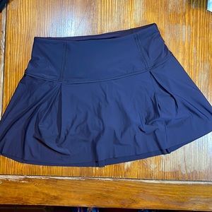 EUC Lululemon size 8 long pleated tennis skort, navy blue